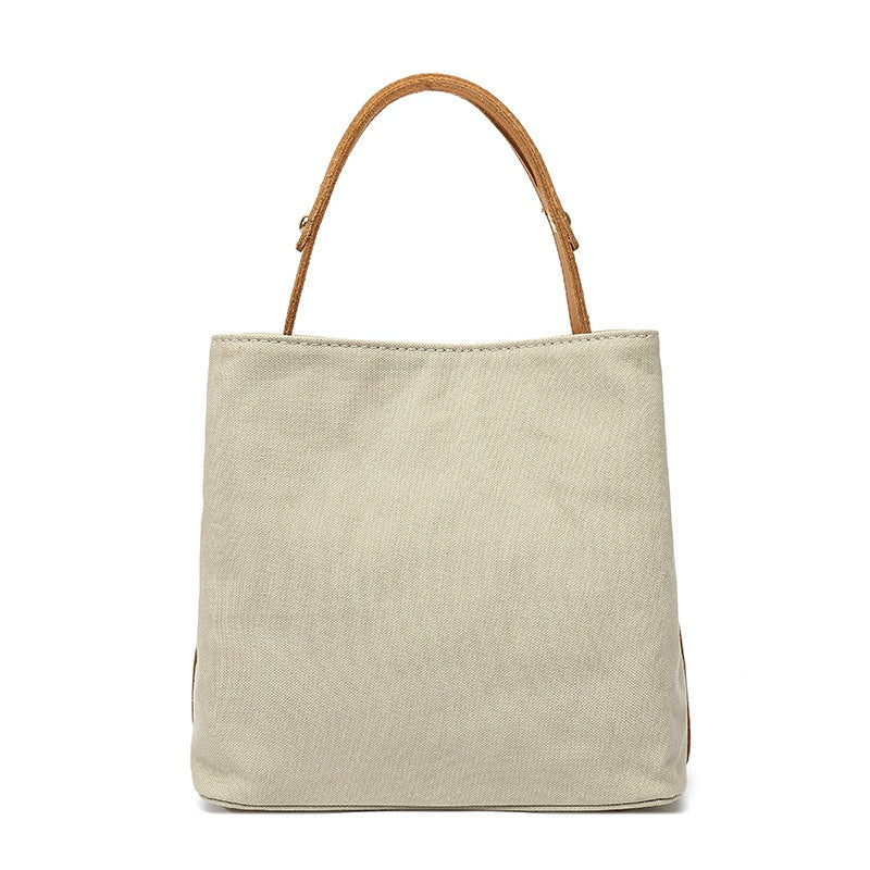 Handbag with leather handle
